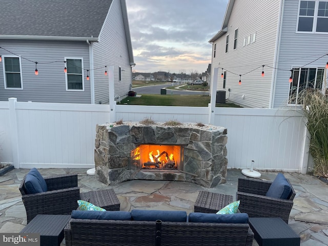 view of patio with an outdoor stone fireplace