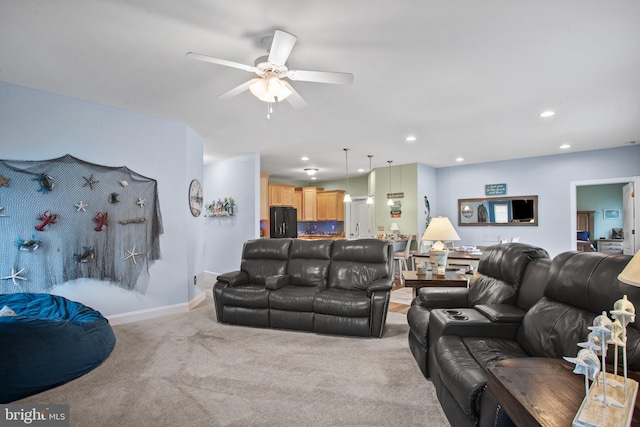 living room with light carpet and ceiling fan