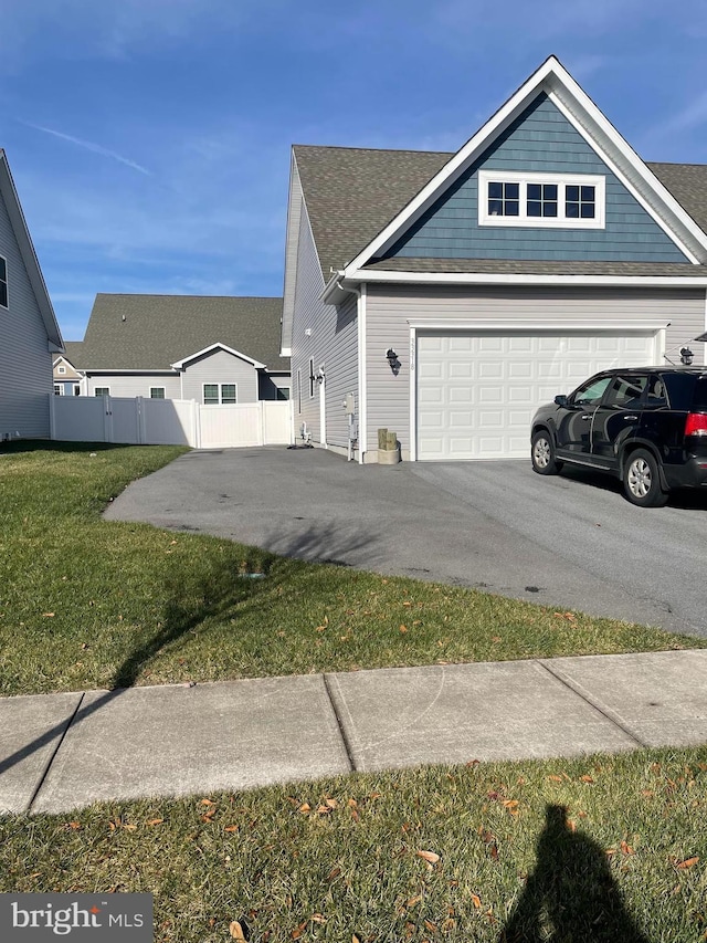 exterior space with a lawn and a garage