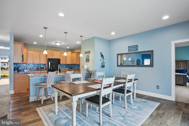 dining room featuring dark wood-type flooring