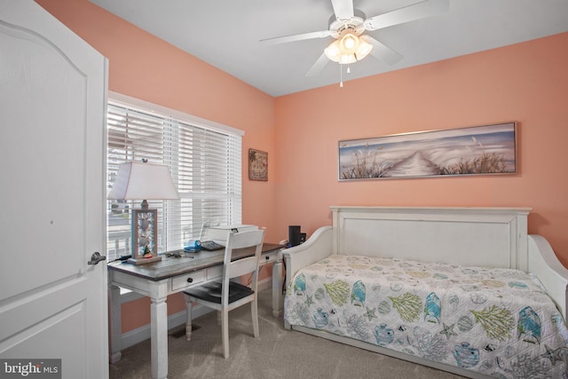 carpeted bedroom featuring ceiling fan