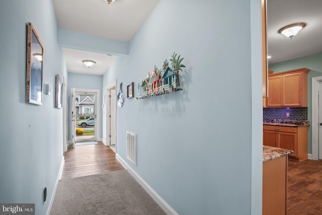 corridor with light colored carpet