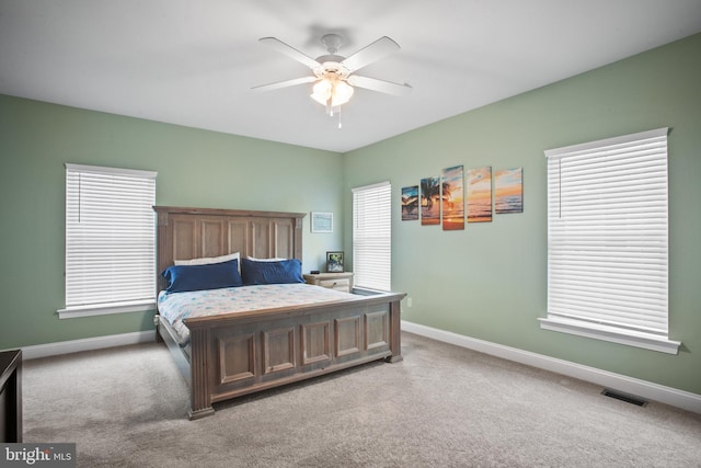 carpeted bedroom featuring ceiling fan