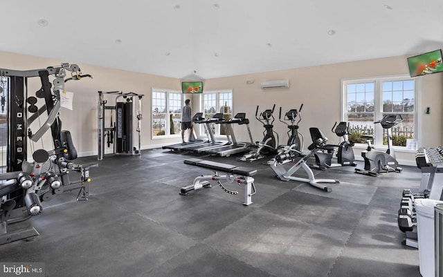 workout area featuring an AC wall unit