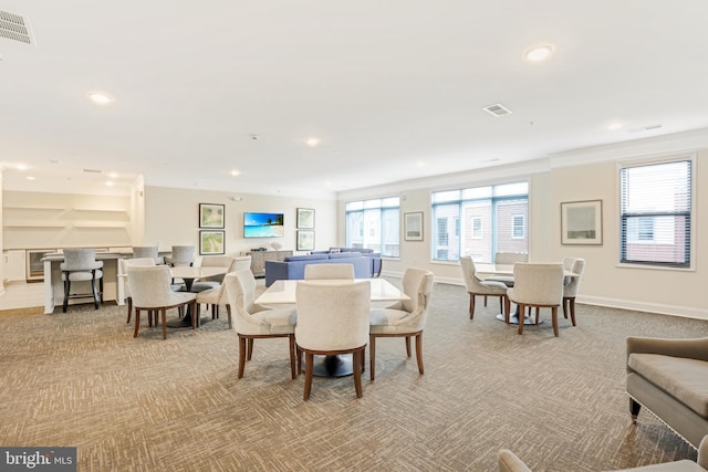 view of carpeted dining area