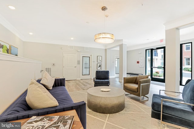 interior space featuring light hardwood / wood-style flooring and ornamental molding