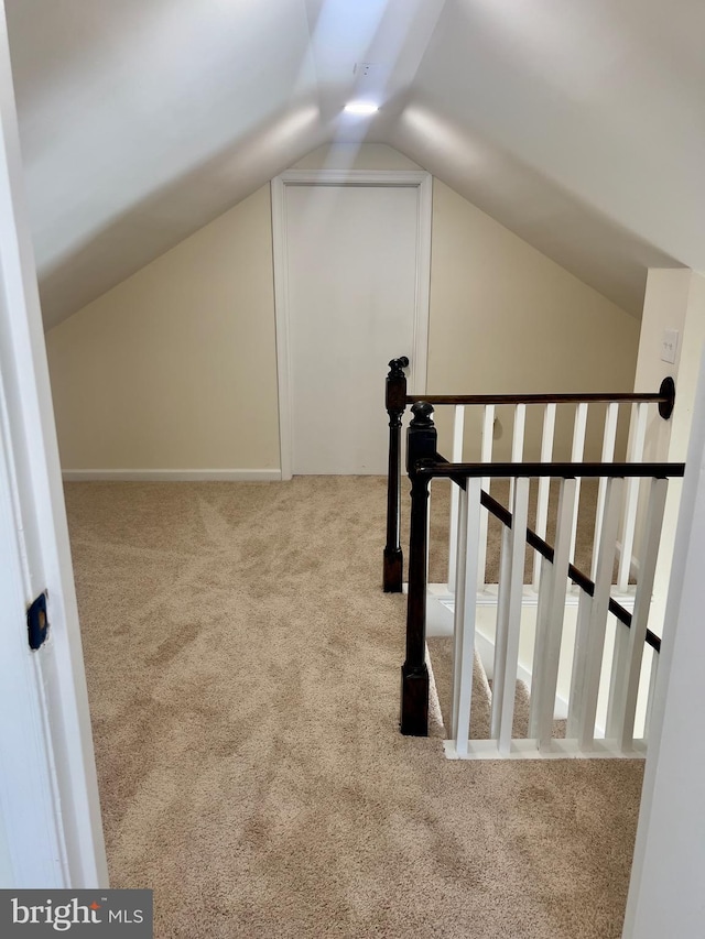 bonus room featuring carpet and lofted ceiling