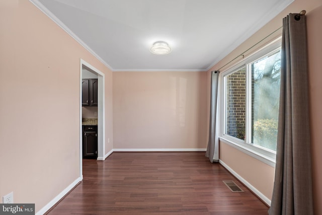 interior space with crown molding and dark wood-type flooring