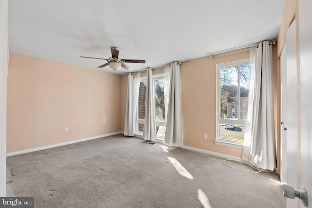 empty room with light carpet and ceiling fan