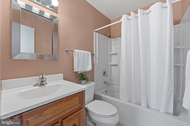 full bathroom with shower / bath combo, vanity, and toilet