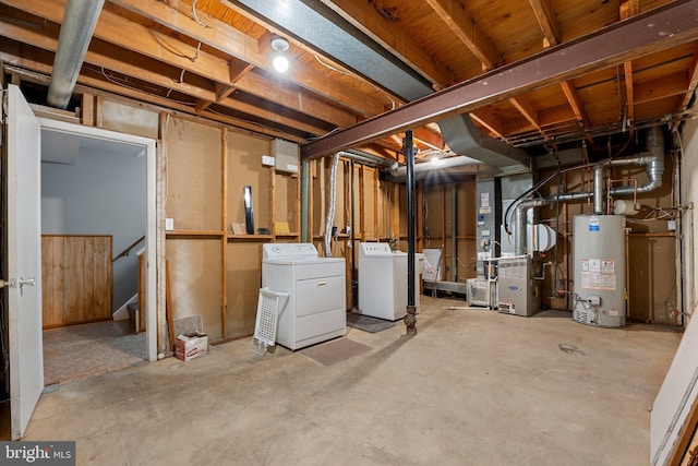 basement with gas water heater and washing machine and clothes dryer