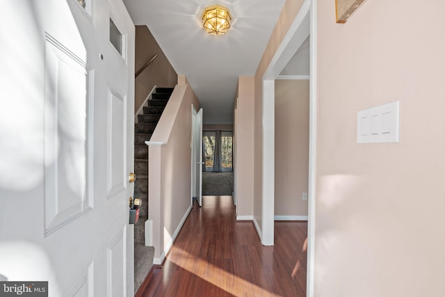 foyer entrance with dark hardwood / wood-style flooring and french doors