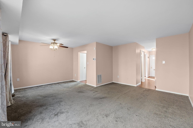 unfurnished living room with carpet flooring and ceiling fan