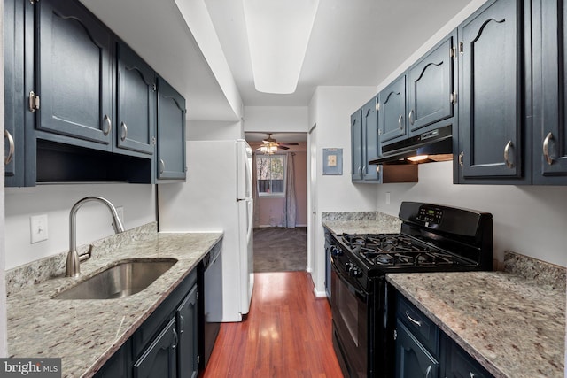 kitchen featuring ceiling fan, sink, dishwasher, black range with gas stovetop, and light stone counters