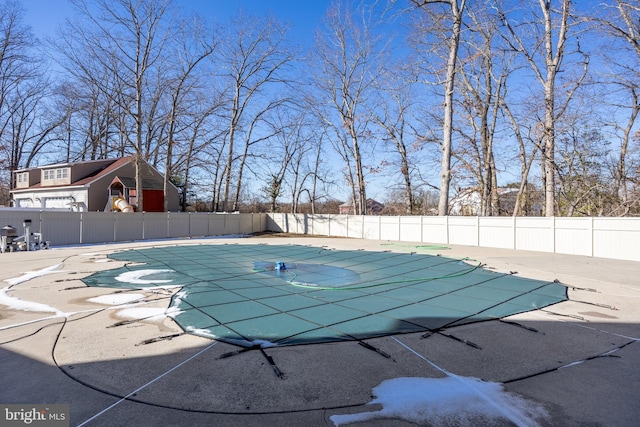 view of swimming pool with a patio