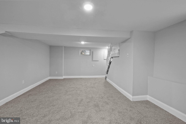 basement with carpet flooring