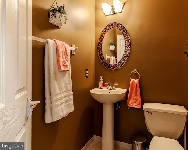 bathroom with toilet and sink