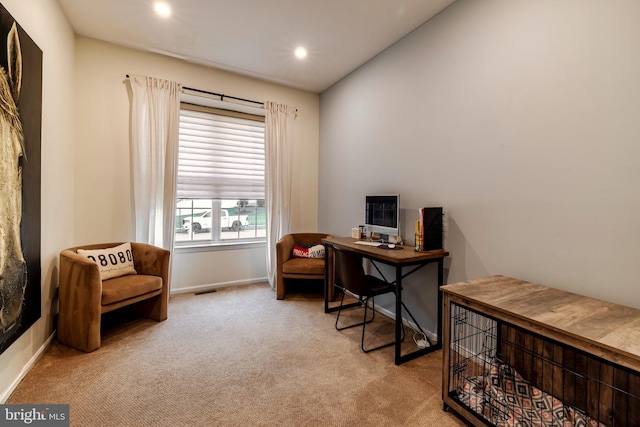 office with light colored carpet and lofted ceiling