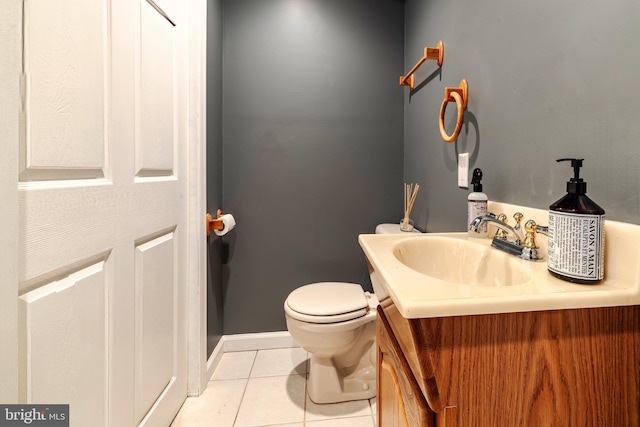 bathroom with tile patterned floors, vanity, and toilet