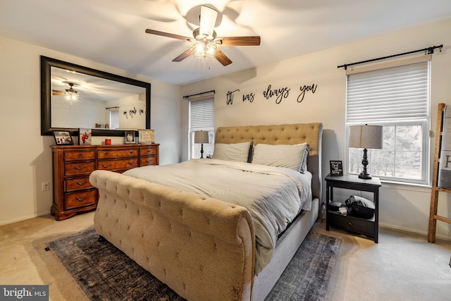 bedroom featuring light carpet and ceiling fan