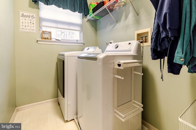 laundry room featuring separate washer and dryer