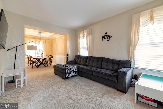 carpeted living room featuring plenty of natural light