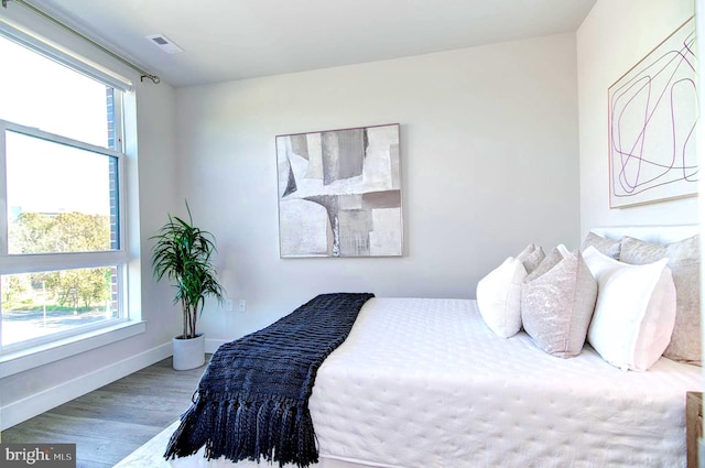 bedroom with hardwood / wood-style flooring