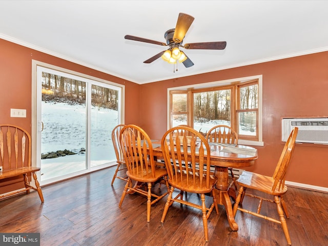 dining room with dark hardwood / wood-style floors, a healthy amount of sunlight, crown molding, and ceiling fan