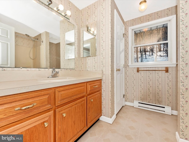 bathroom featuring walk in shower, vanity, and baseboard heating