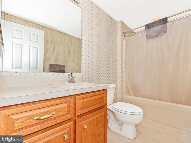 full bathroom featuring vanity, toilet, and shower / tub combo with curtain