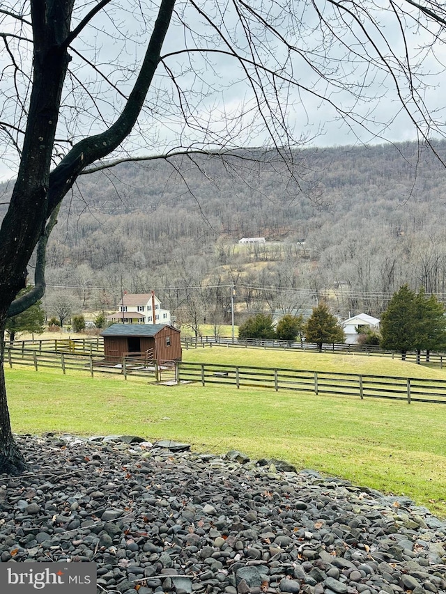 view of yard with a rural view