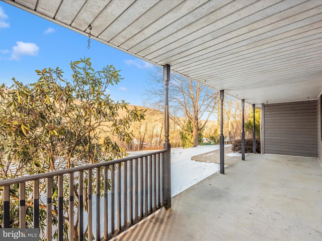 view of patio / terrace with a mountain view and a balcony