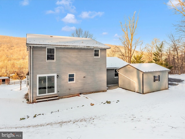 view of snow covered house