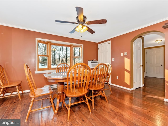 dining room featuring ceiling fan, dark hardwood / wood-style flooring, and crown molding