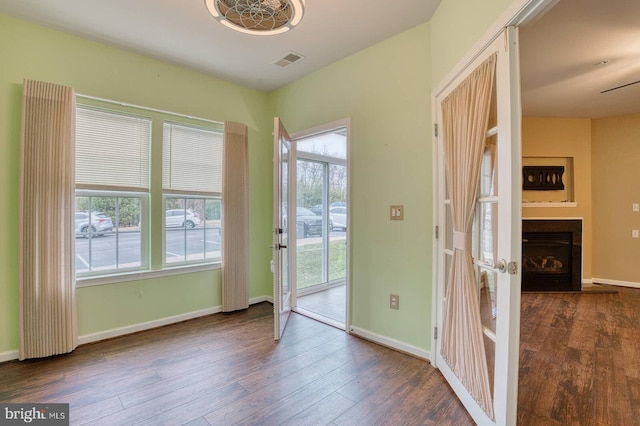 doorway to outside with dark wood-type flooring