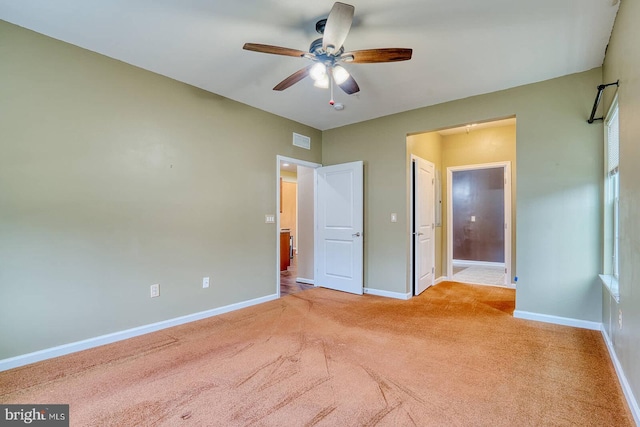 unfurnished bedroom with ceiling fan and light carpet