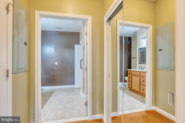 hallway featuring electric panel