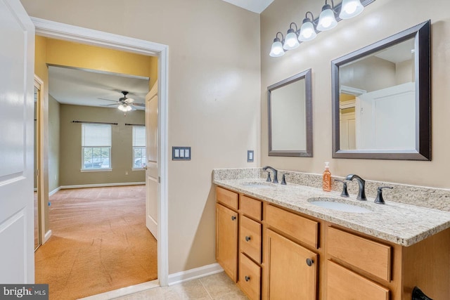 bathroom featuring tile patterned floors, ceiling fan, and vanity