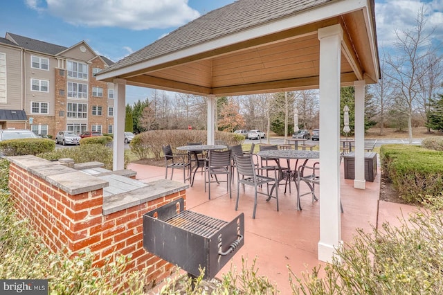 view of patio / terrace with a gazebo and a bar