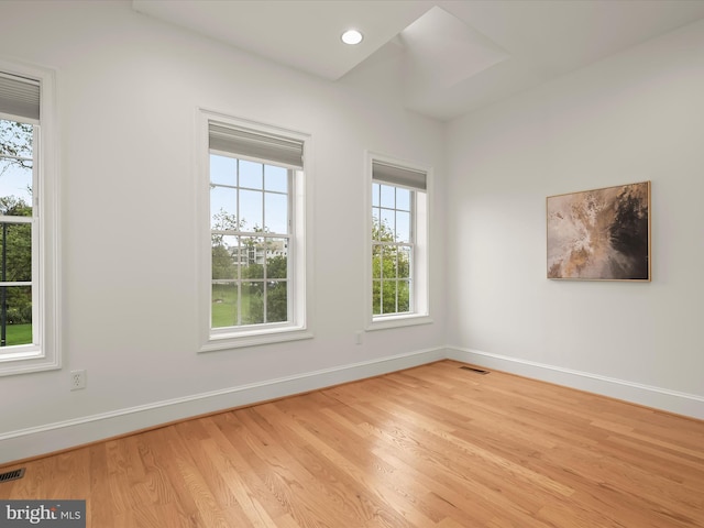 spare room with light wood-type flooring