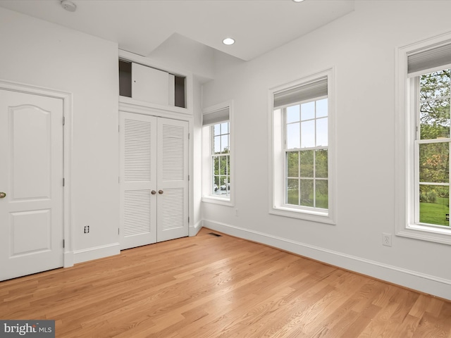 unfurnished bedroom featuring light wood-type flooring