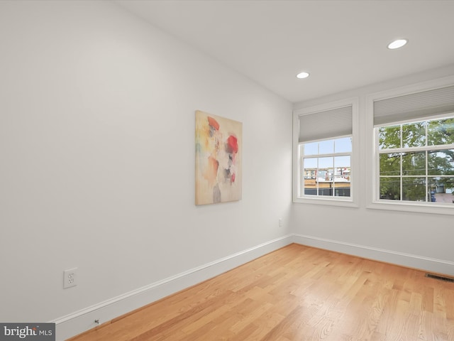 spare room with light hardwood / wood-style flooring