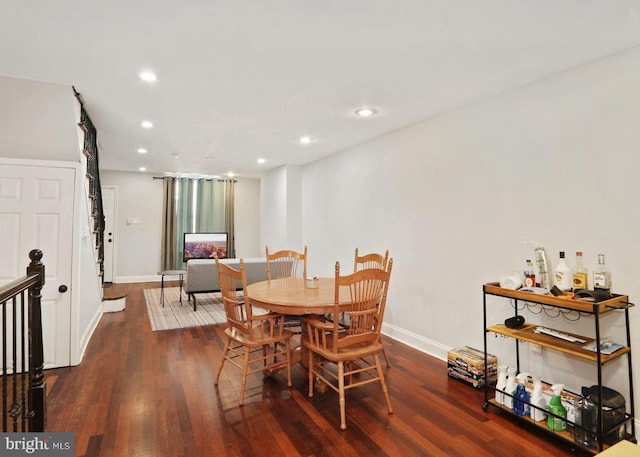 dining room with dark hardwood / wood-style floors