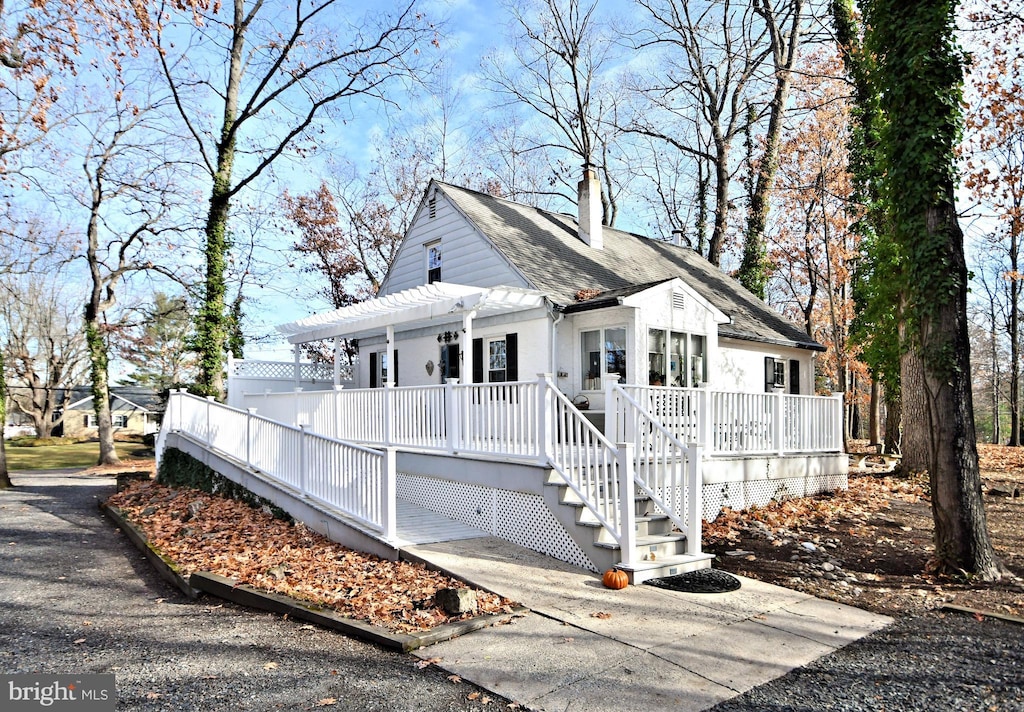 view of front facade with a wooden deck