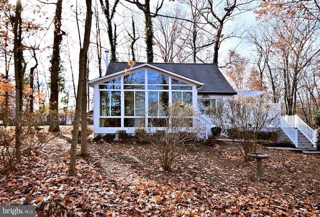 view of front of home with a sunroom