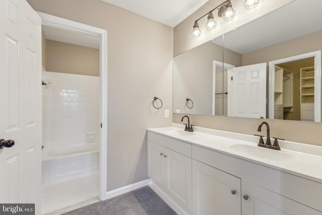 bathroom with vanity and  shower combination