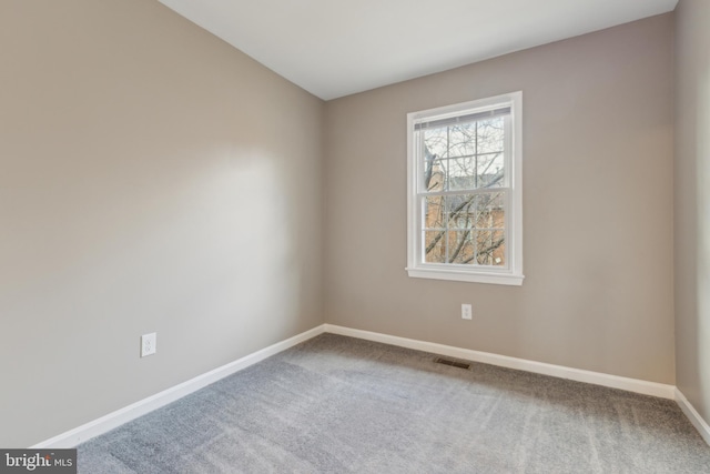 unfurnished room with carpet floors