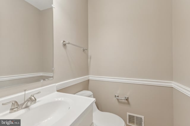 bathroom featuring toilet and sink