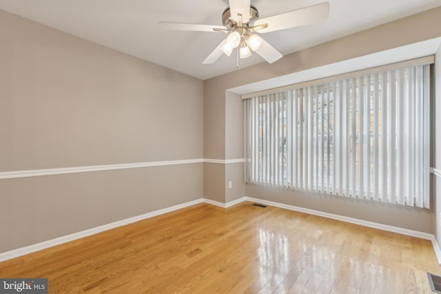 empty room featuring ceiling fan and light hardwood / wood-style flooring