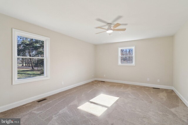 carpeted empty room with ceiling fan